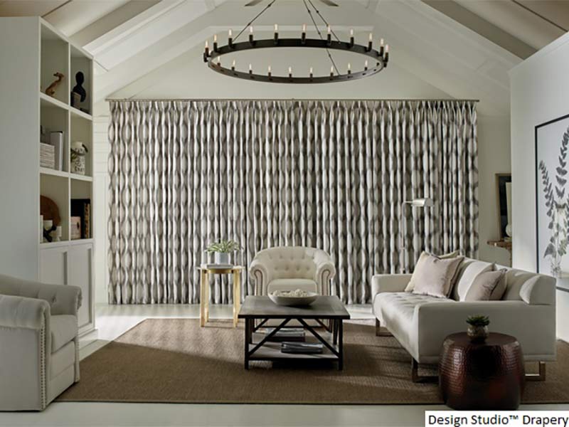 Patterned drapery in bright living room scene