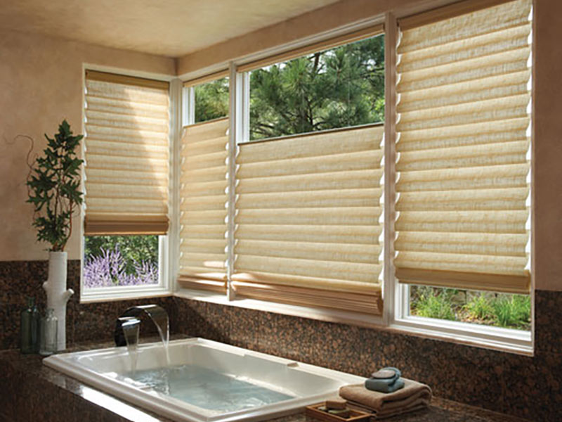 Beige window shades in kitchen with brown countertops