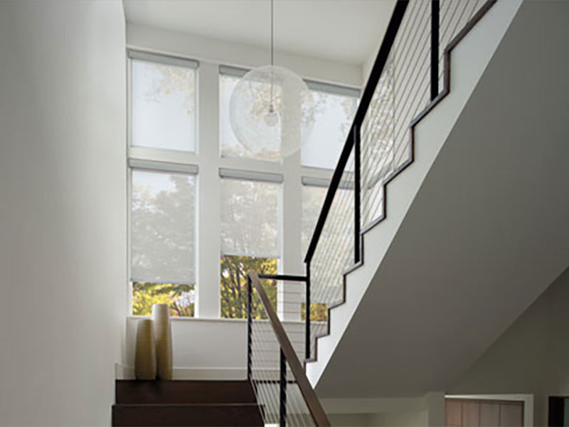 White shades in nearly all white stairwell