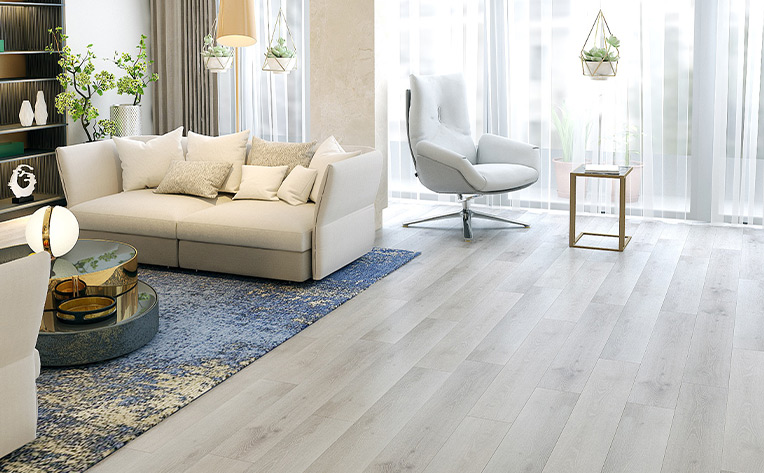 wood flooring in living room with Patina Blue area rug